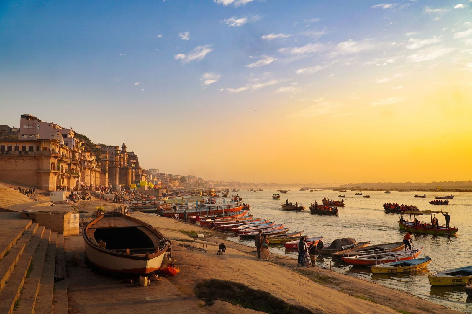 Boats on the Ganga in front of the ghats of Varanasi at sunrise