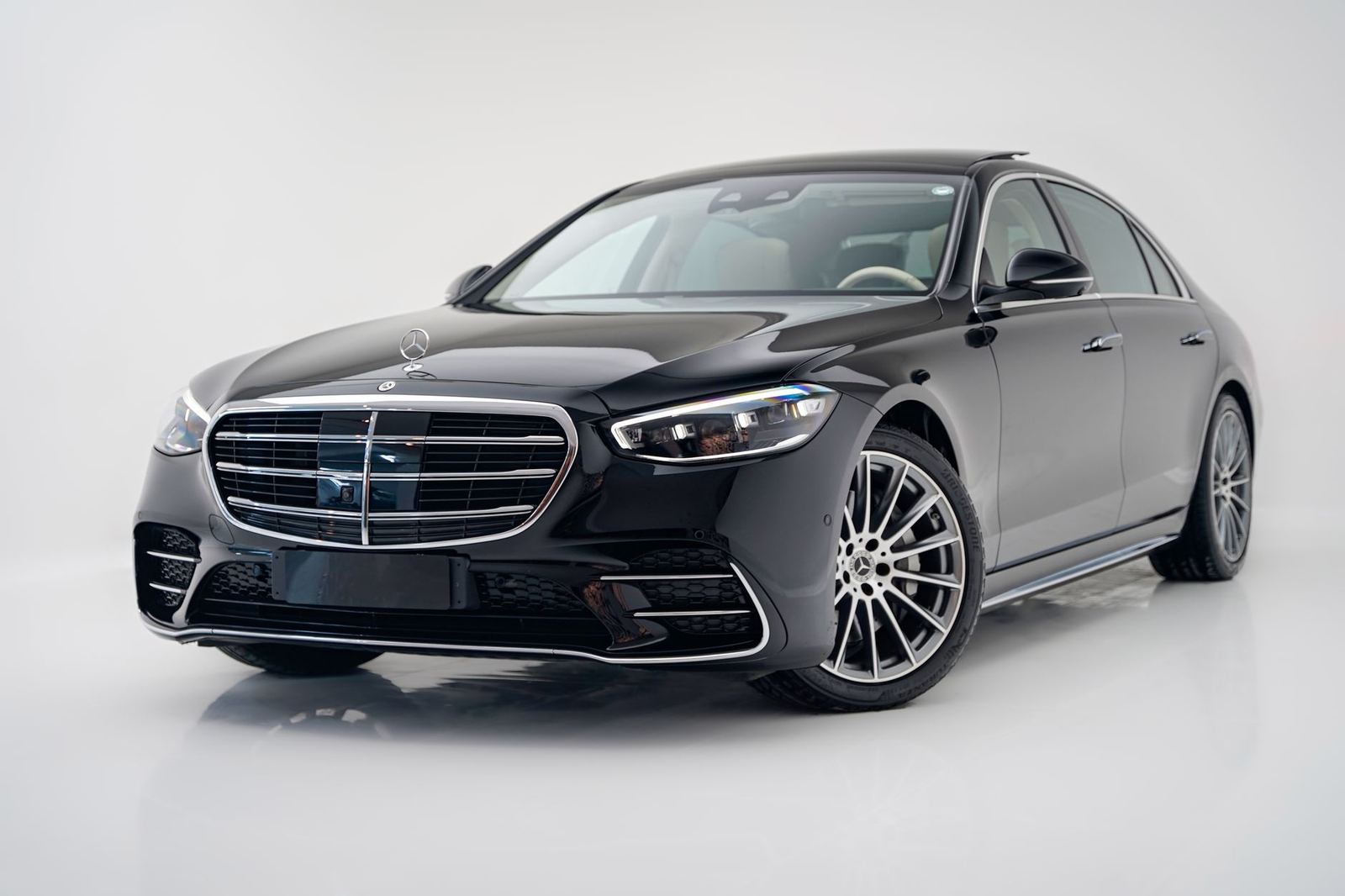 A black Mercedes-Benz S-Class sedan