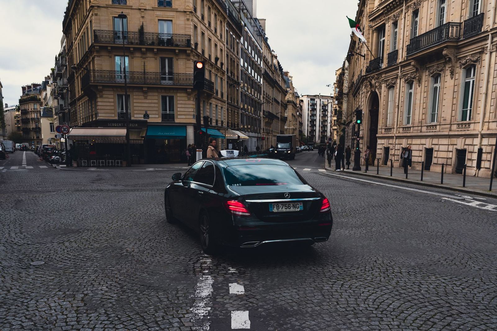 A black Mercedes-Benz E-Class sedan
